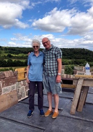 Paul with Merryn Lloyd on the roof of the tower which is being re-leaded