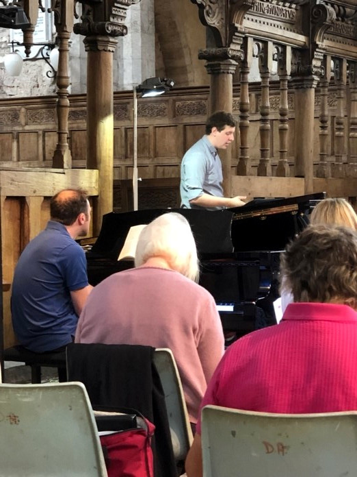 Thomas Mottershead taking a rehearsal with Mark Opstad at the piano
